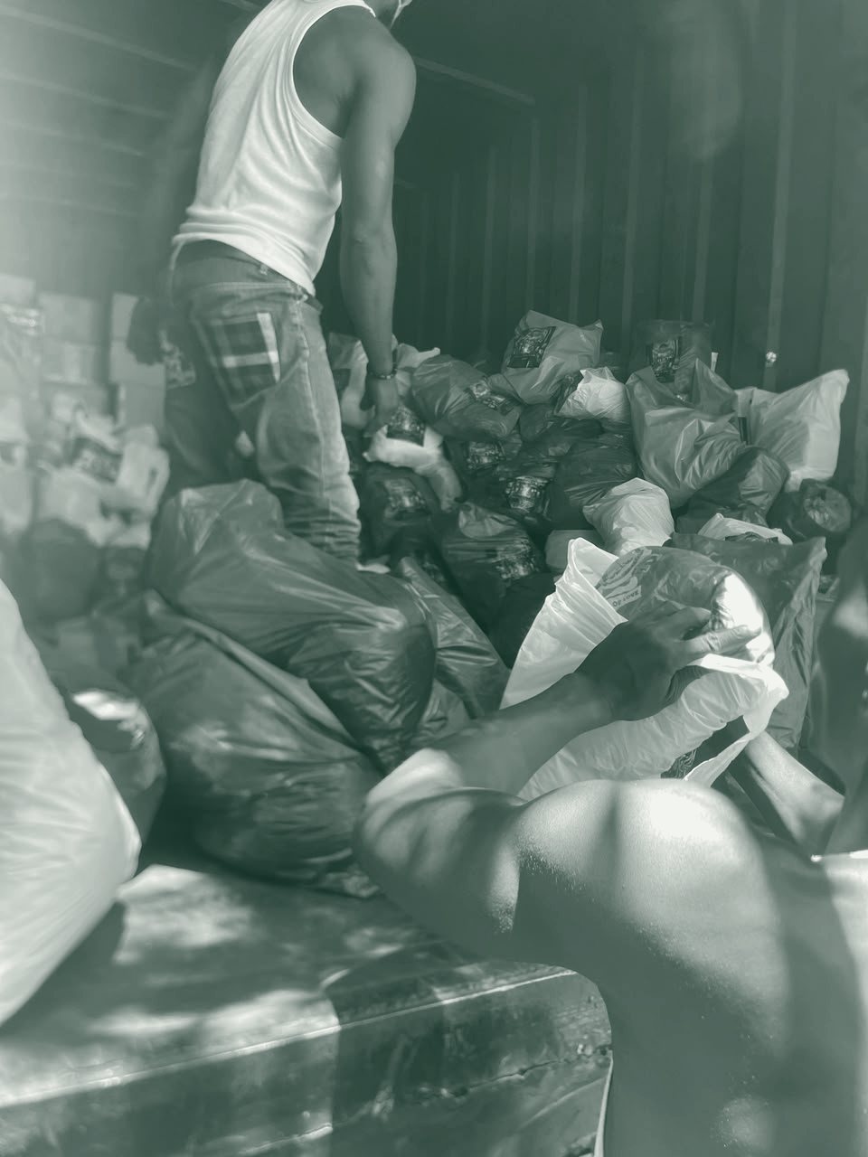 Bags of food packages ready for distribution to families.